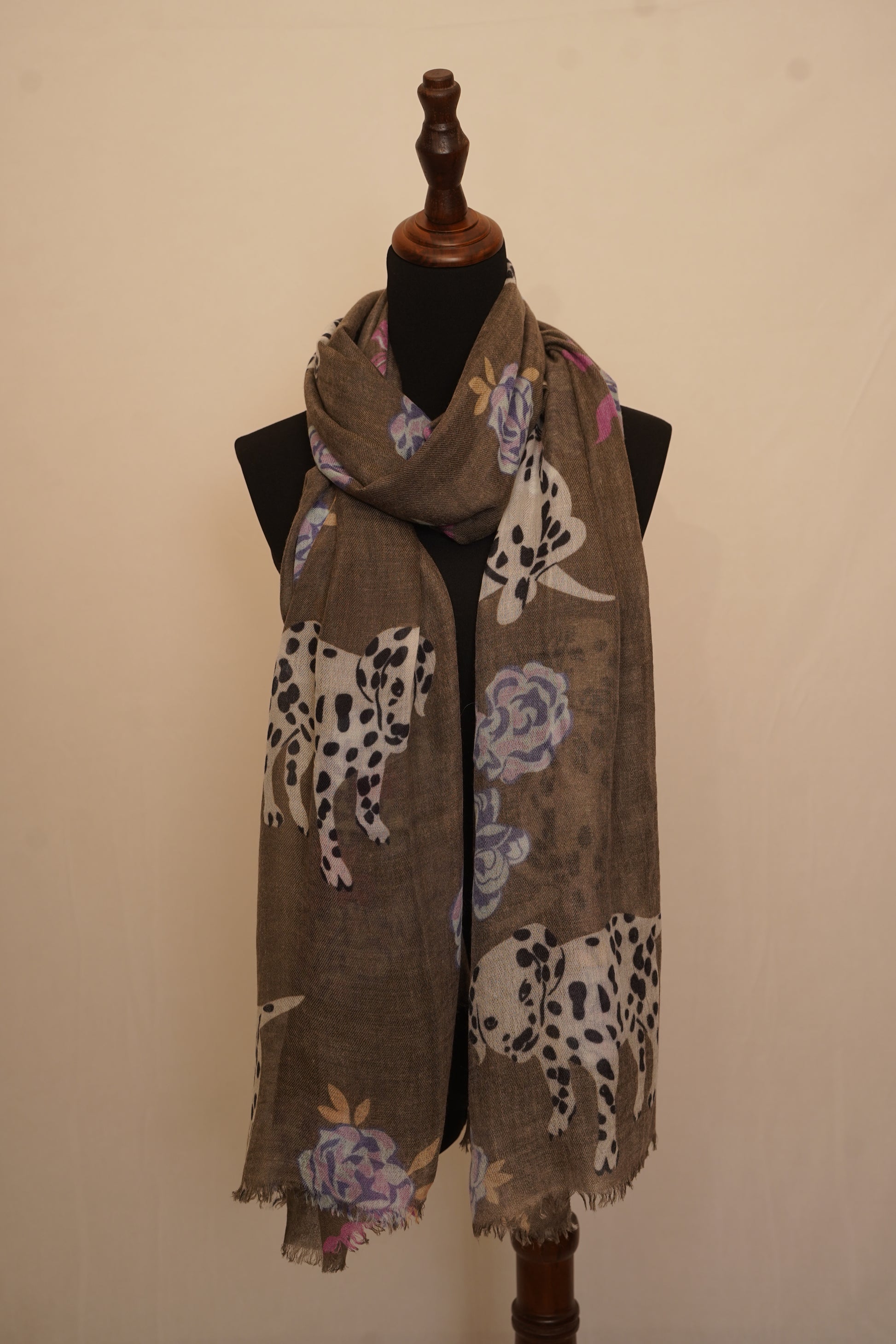 A beautiful designer cashmere shawl inspired by dogs and flowers.