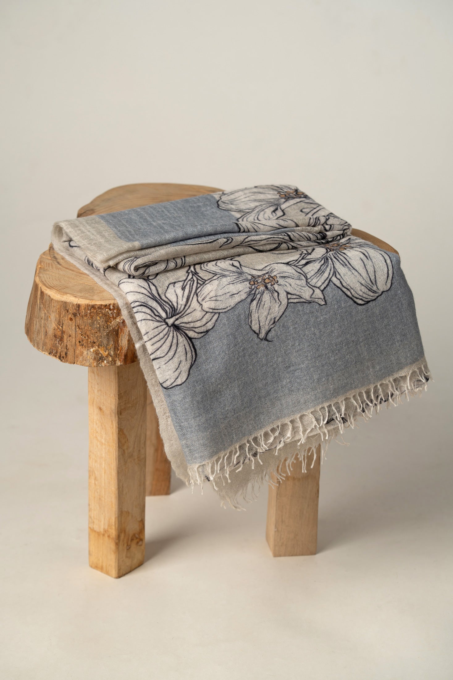 Luxury handwoven designer wrap in ice blue flowers print made of cashmere