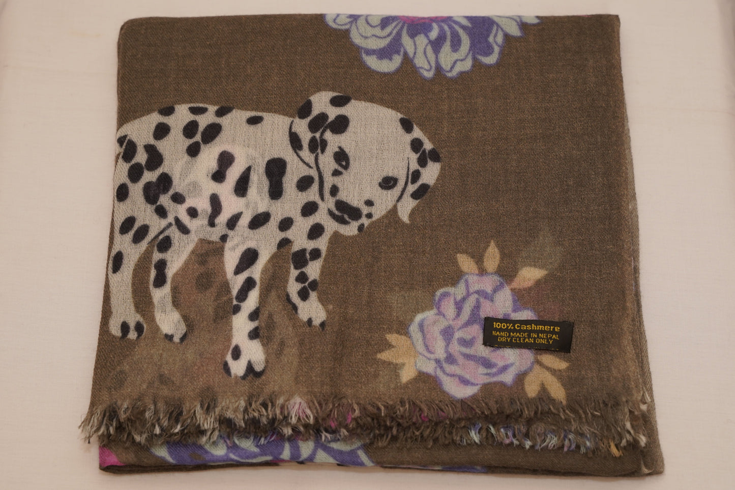 The shawl is made of pure pashmina with a unique dog and floral print.