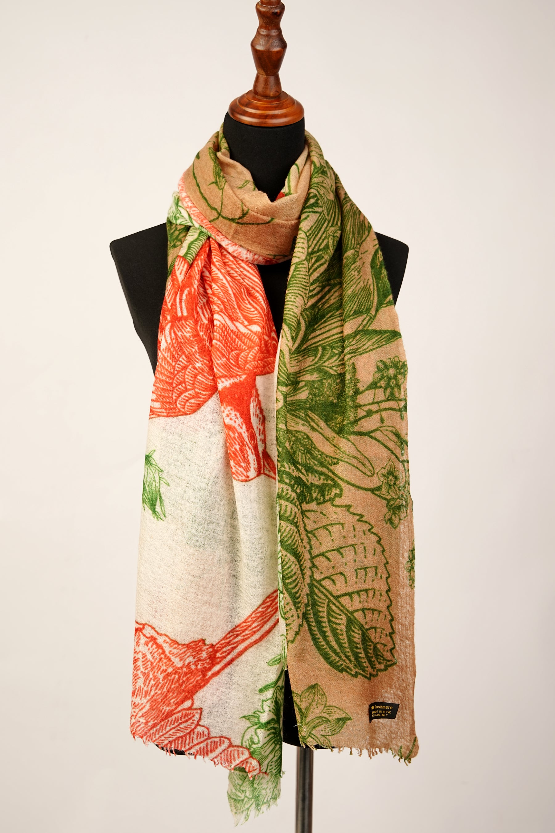 This is a vibrant mud green and orangey red cashmere shawl with a flower print