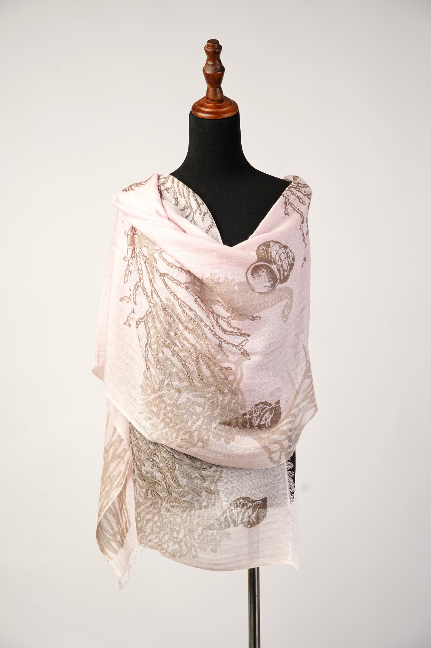 The Conch Shell Sea Horse Ocean Printed Light Peach Cashmere Shawl is perfect for any season.