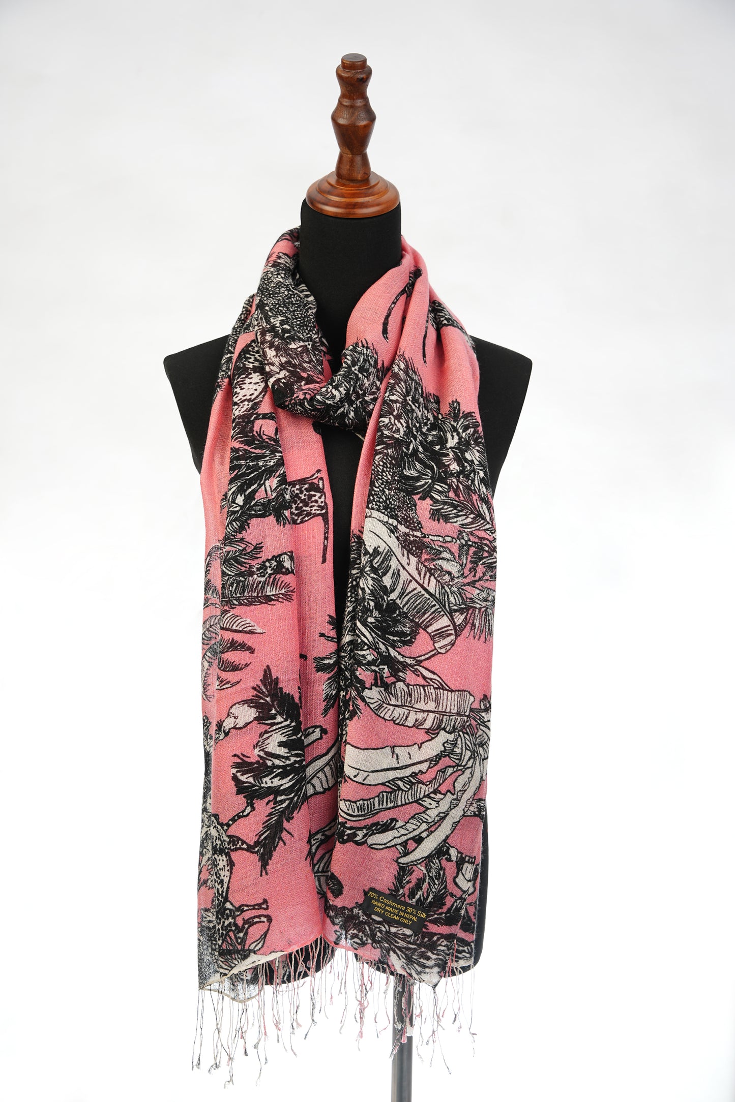 This wrap features a beautiful cashmere and silk blend shawl with a pink and black jungle theme print.