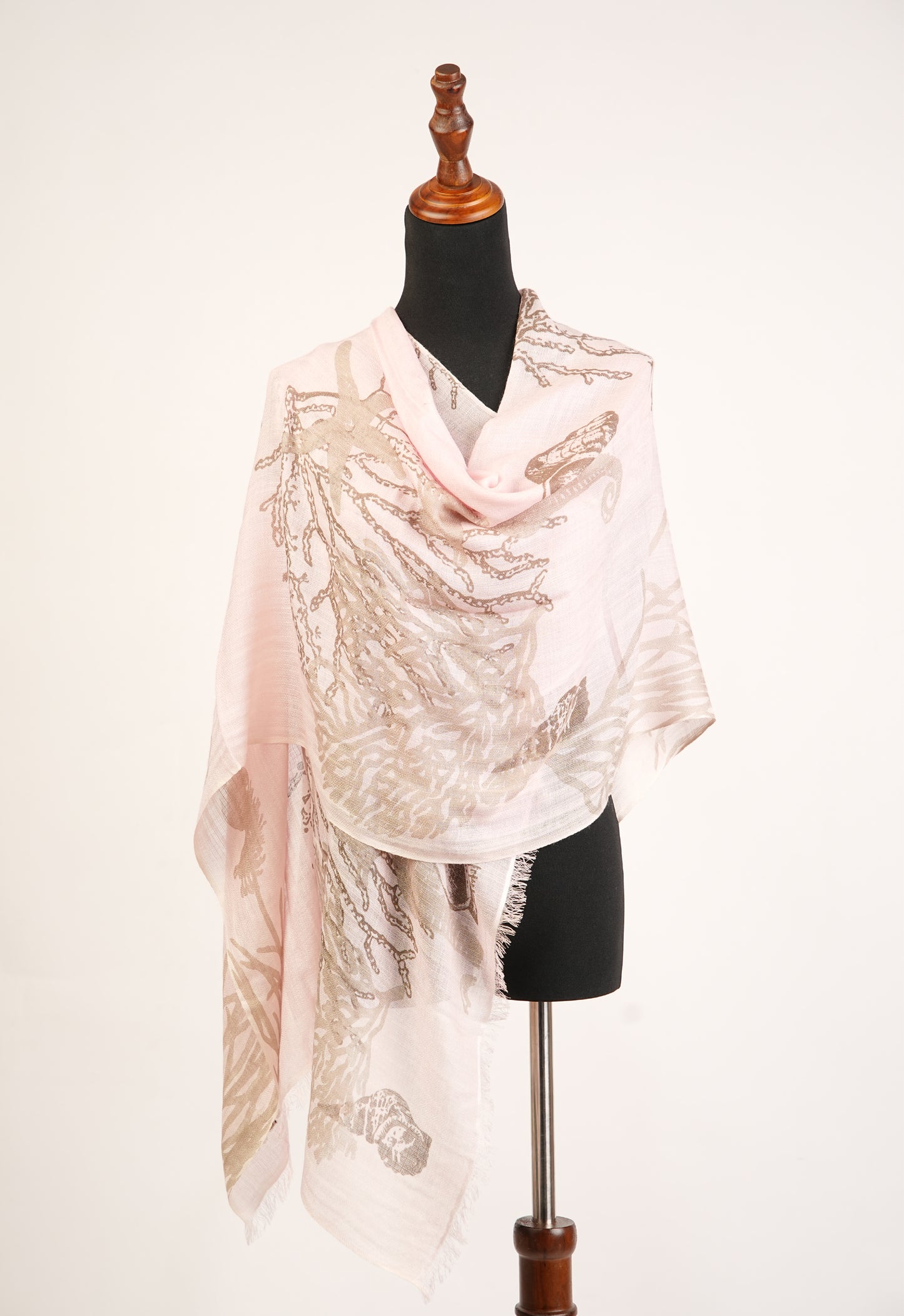 The Conch Shell Sea Horse Ocean Printed Light Peach Cashmere Shawl is perfect for any season.