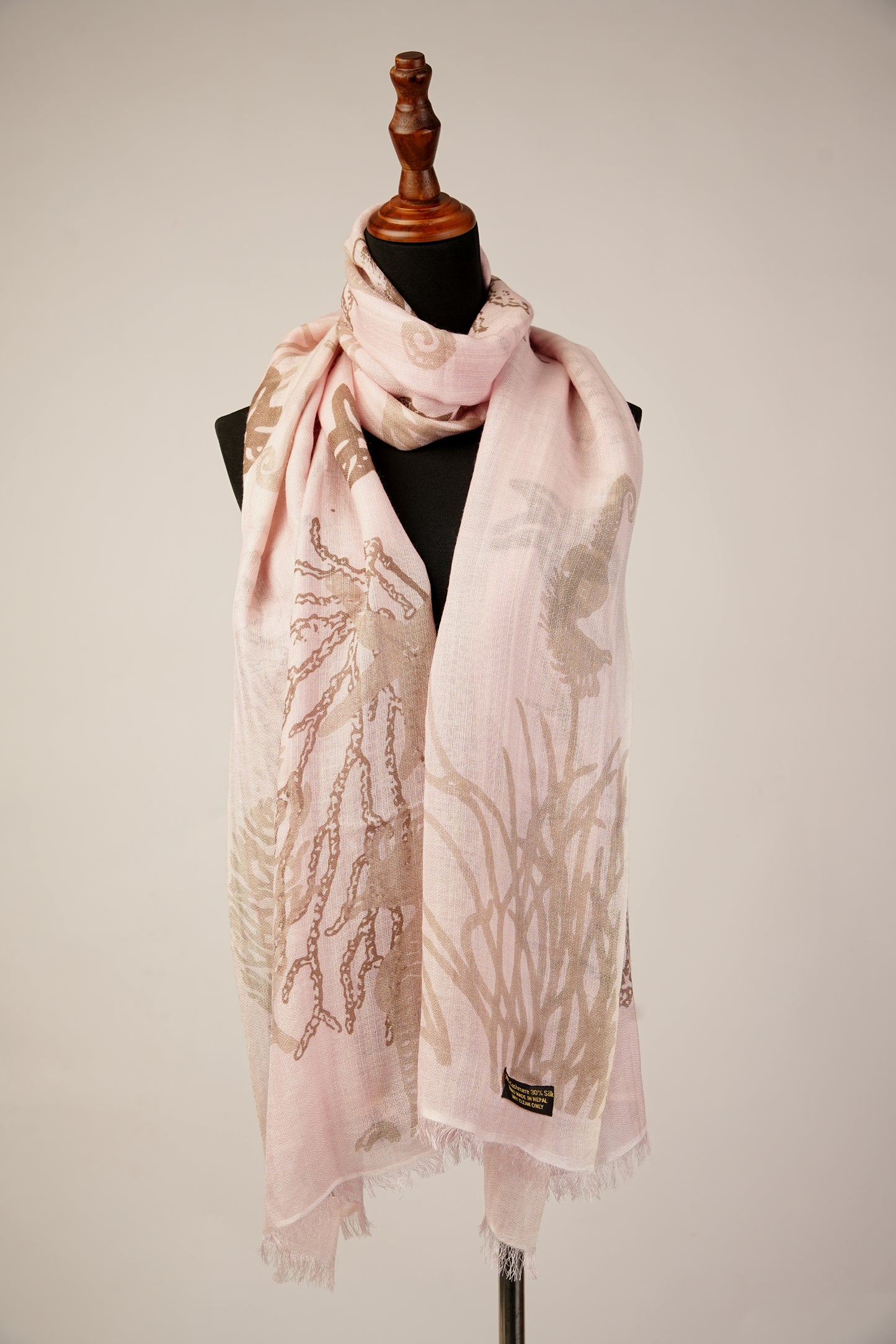 The Conch Shell Sea Horse Ocean Printed Light Peach Cashmere Shawl is perfect for any season.