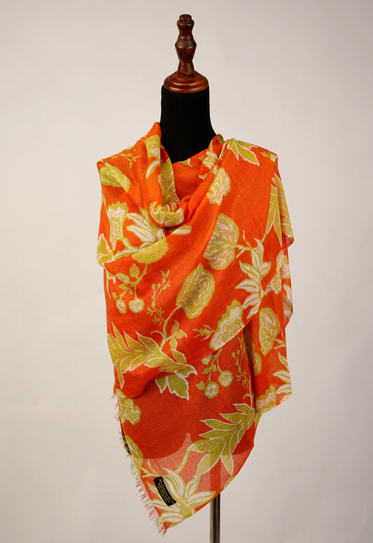 The stole is a brilliant combination of tiger orange and floral print, made from luxurious cashmere and silk.