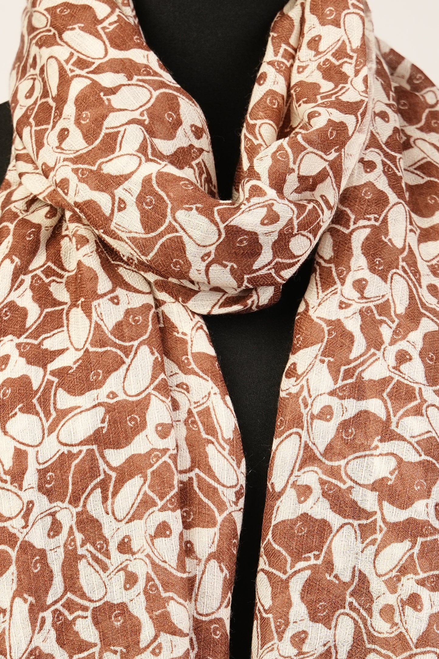 An adorable light brown  puppy print cashmere shawl, wrap, or scarf for dog lovers