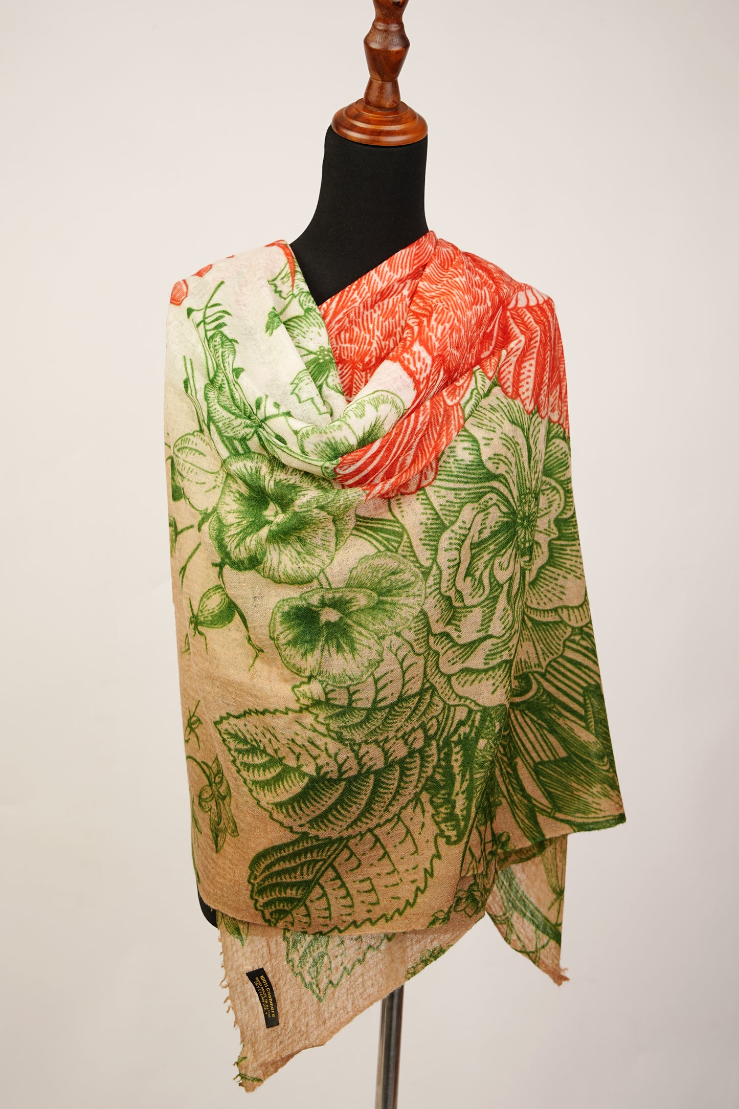 This is a vibrant mud green and orangey red cashmere shawl with a flower print