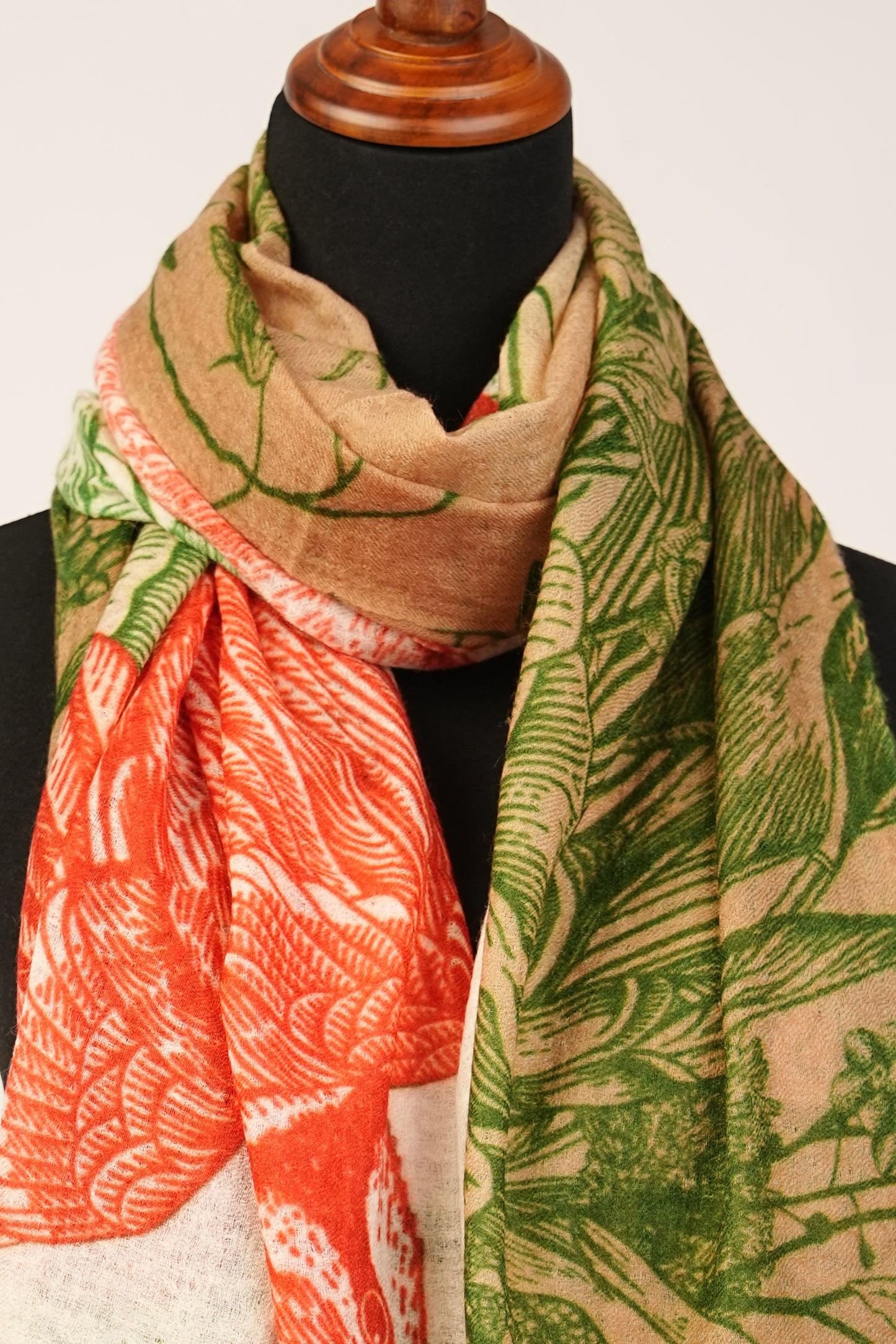 This is a vibrant mud green and orangey red cashmere shawl with a flower print