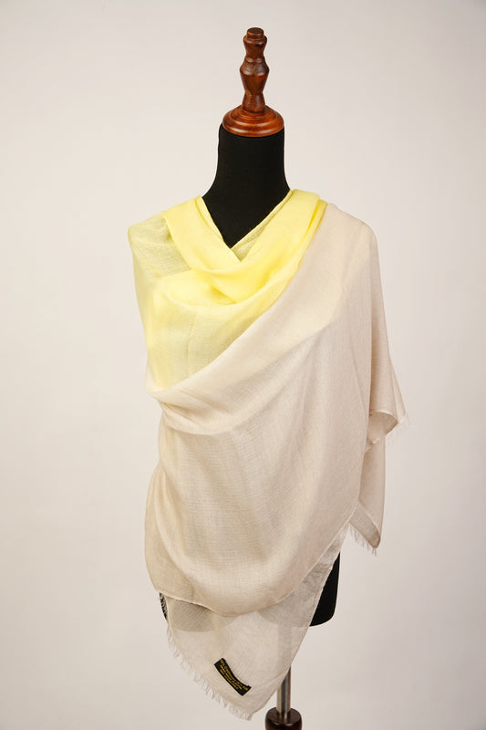 A pashmina and silk wrap in beige and lemon-yellow, suitable for both casual outings and formal events.