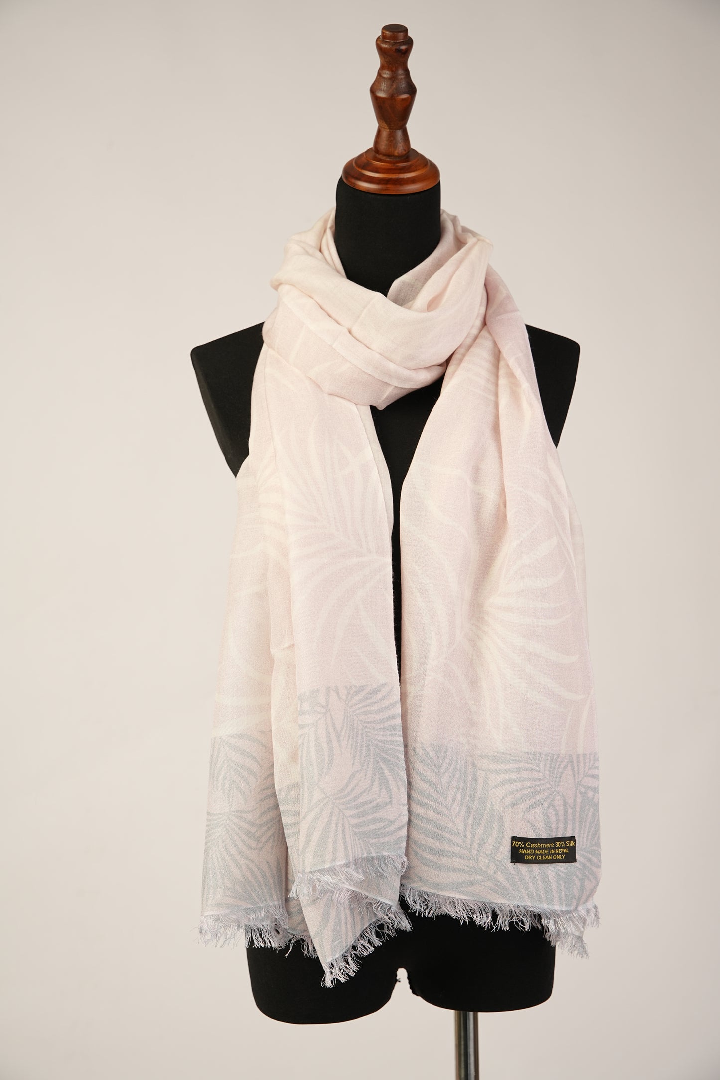 Baby pink pashmina and silk shawl with a leaf print are light in color