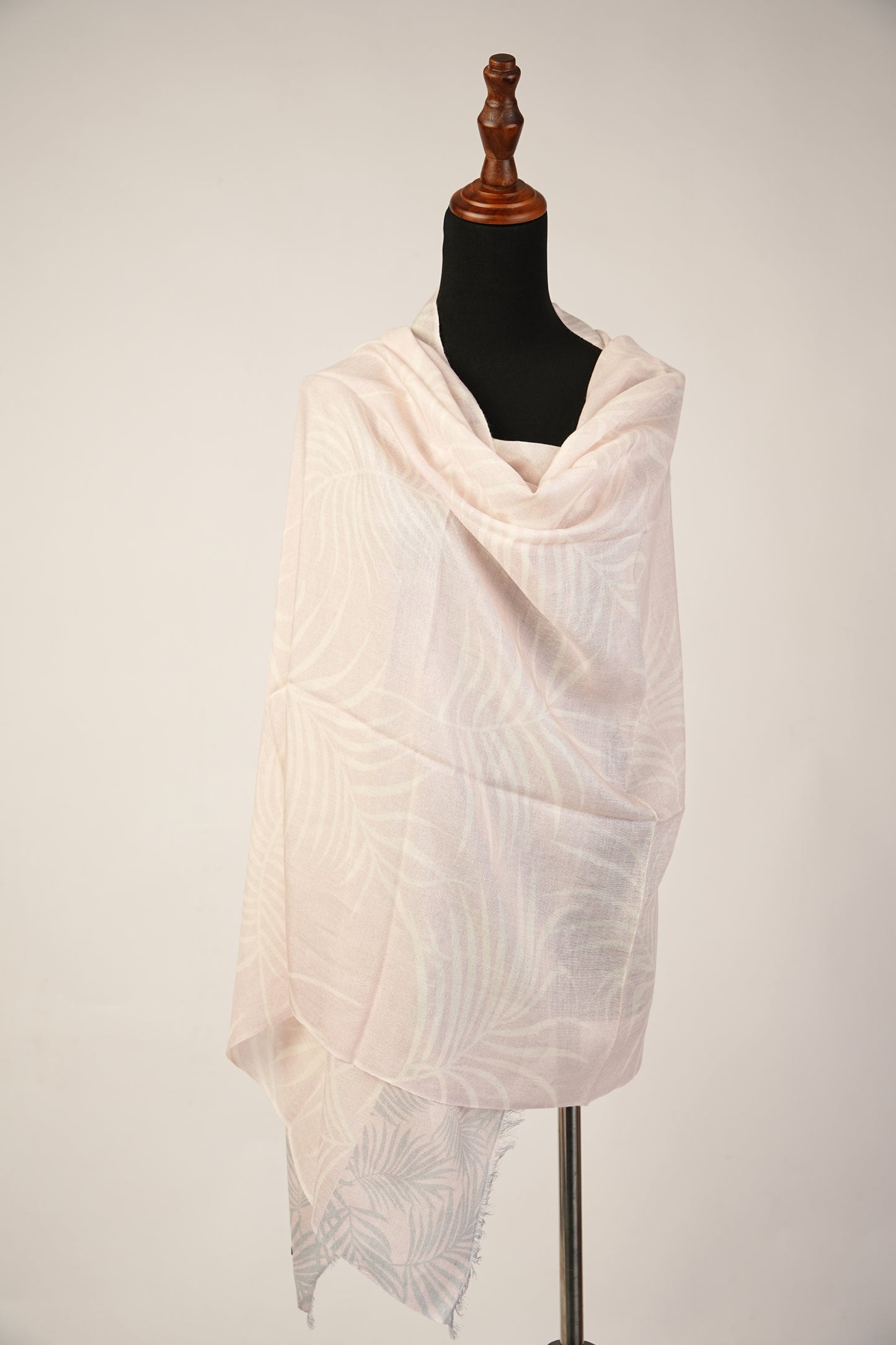 Baby pink pashmina and silk shawl with a leaf print are light in color