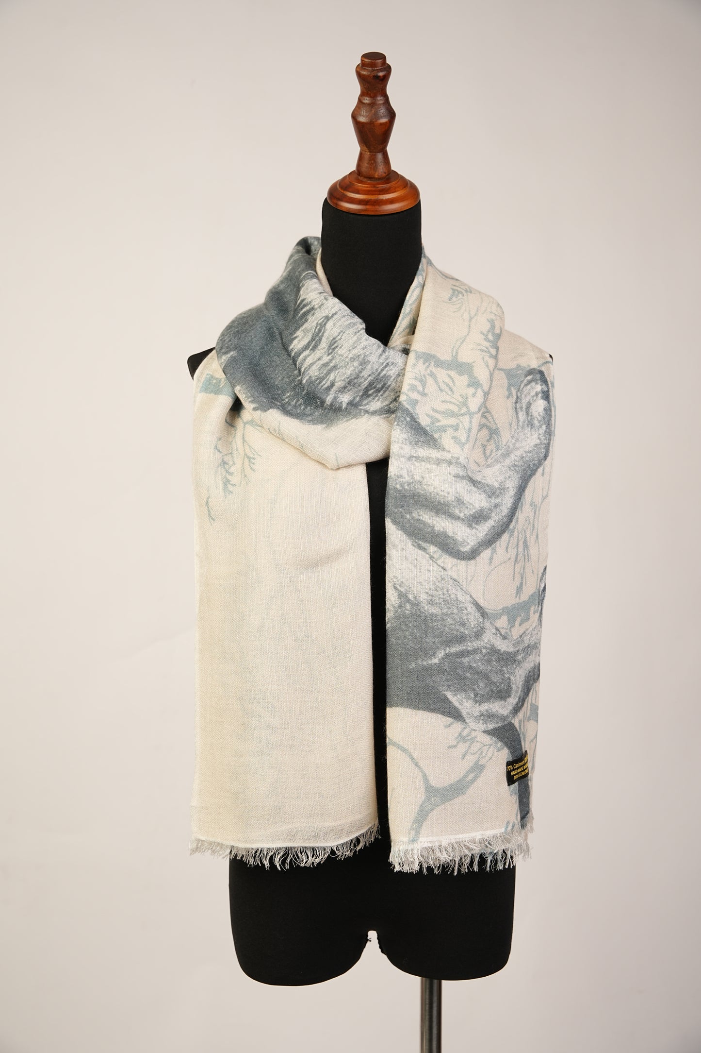 The Pashmina and Silk combination shawl features a lion design print.