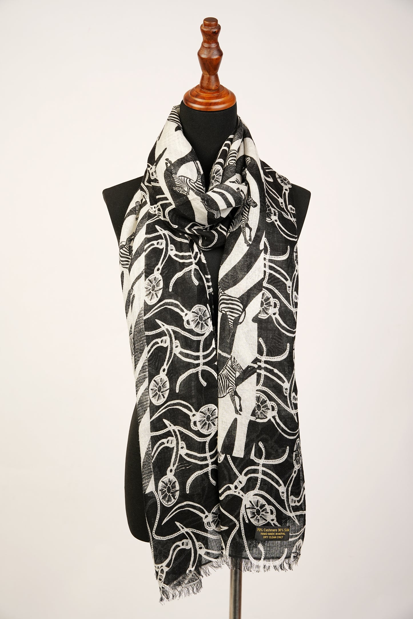 Bright zebra print shawl is made of a blend of cashmere and silk